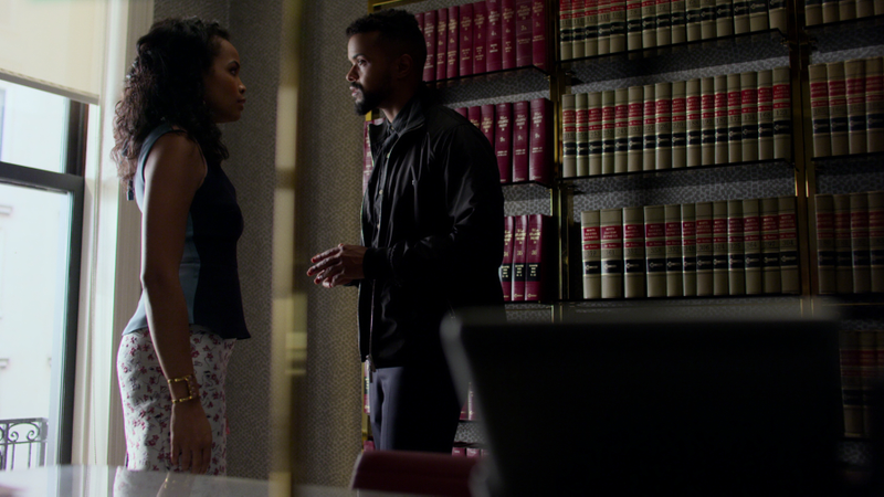 Zaya and Malcolm having a tense conversation.
